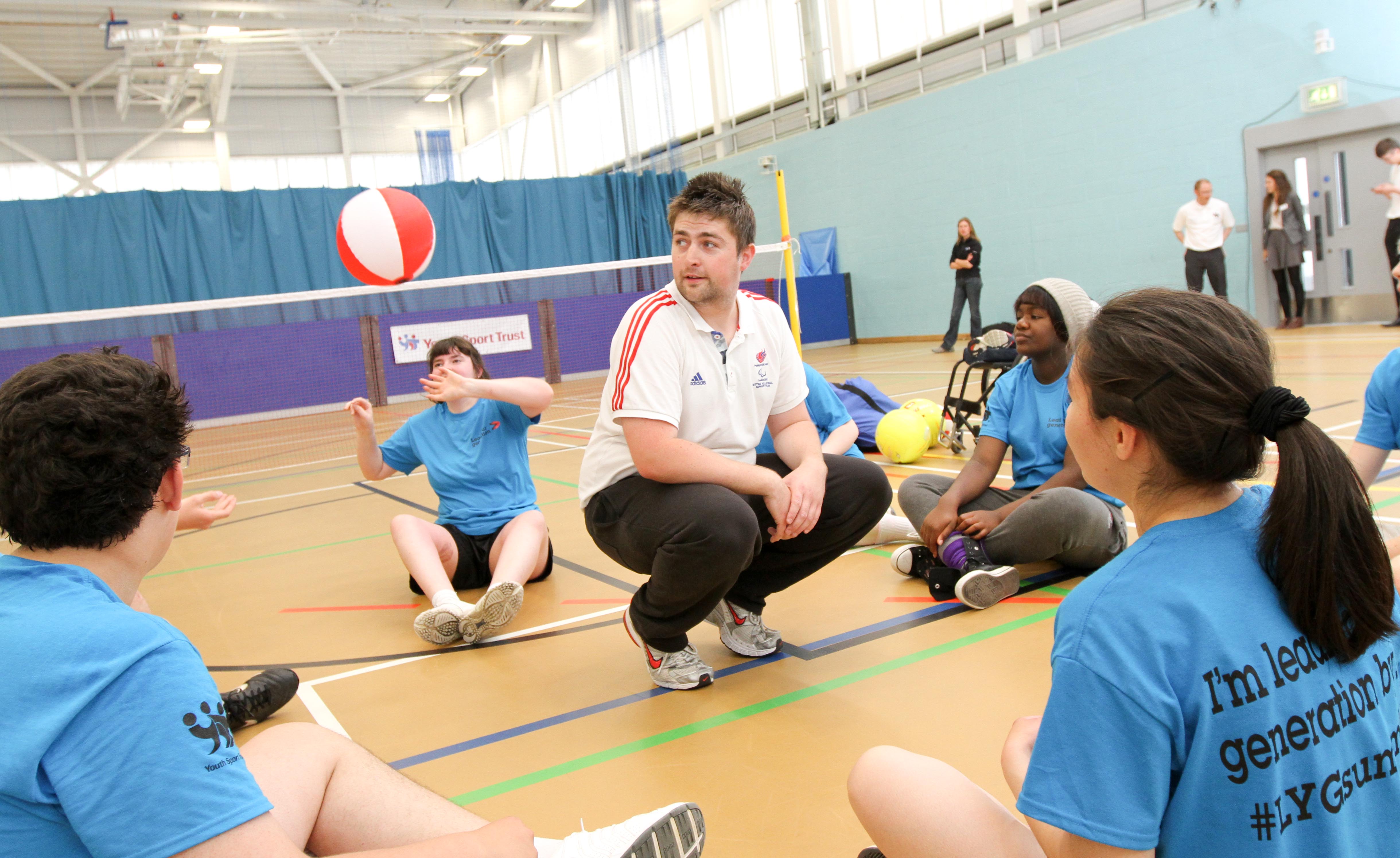 The young people try to keep the ball above Rich's head! Pictute courtesy of YST